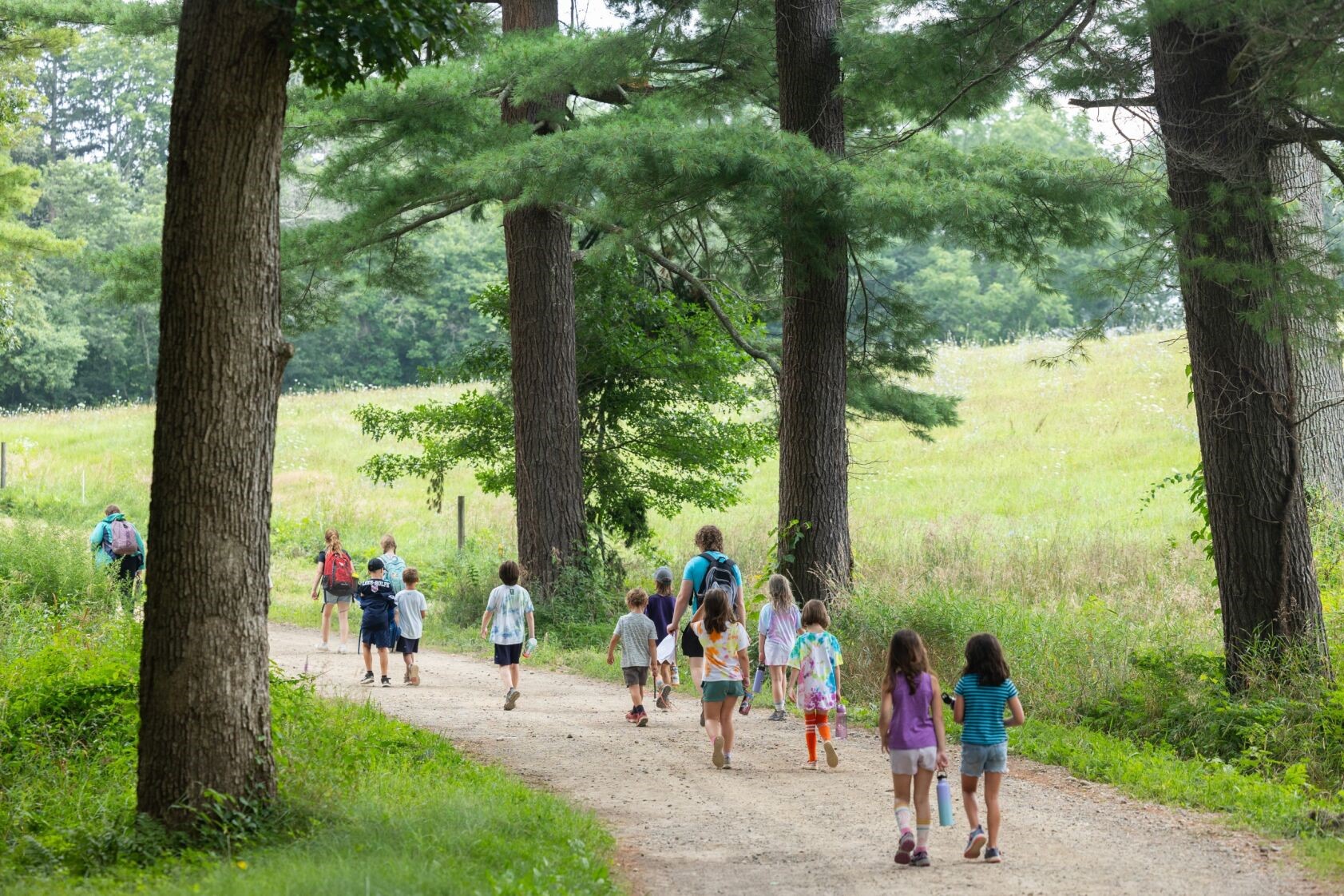 Campers walking down the path at Appleton Farms