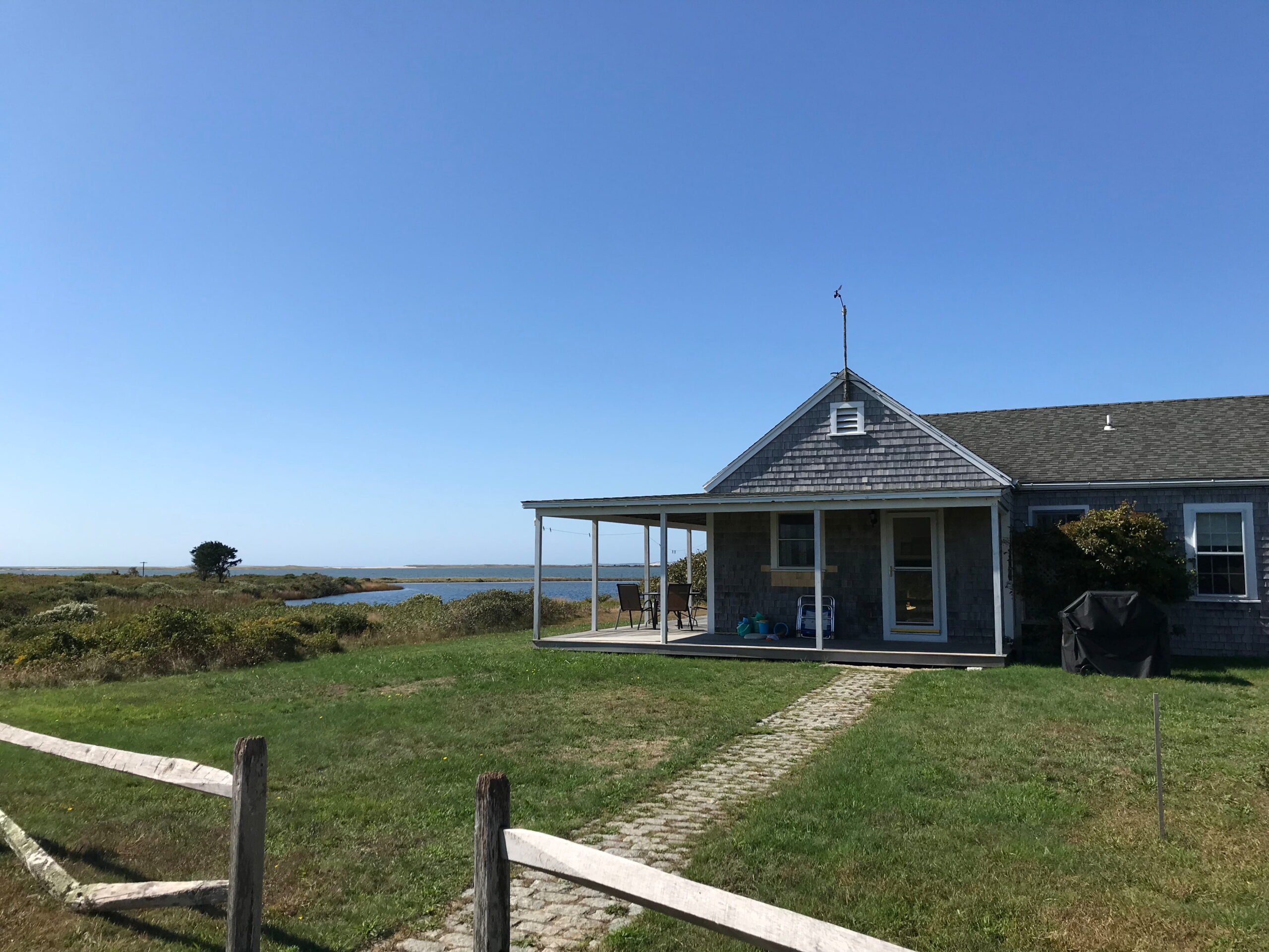Long Point Beach Cottage, with view of water in the background, scaled