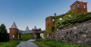 the brick back side of deCordova with ivy and turrets