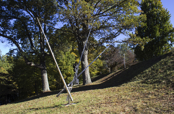 a stainless steel sculpture with three prongs