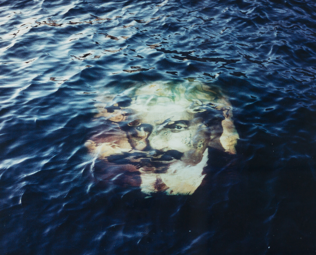 artwork, a mans face in the water