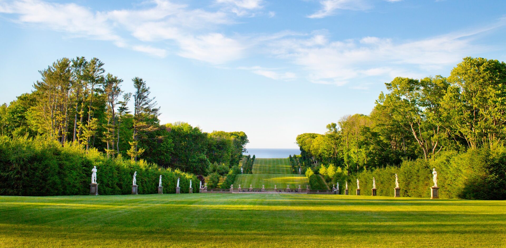 Gardens with green grass and trees at the Castle Hill Estate