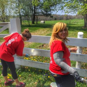 Two volunteers participate in a corporate volunteer day at Appleton Farms.