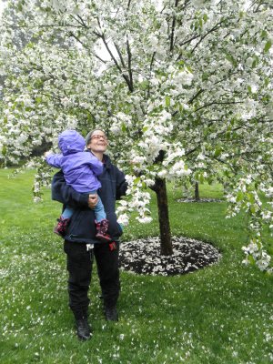 mom and baby in apple blossoms