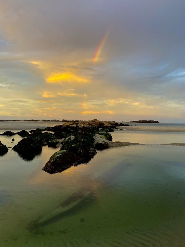 Sunset shipwreck rainbow