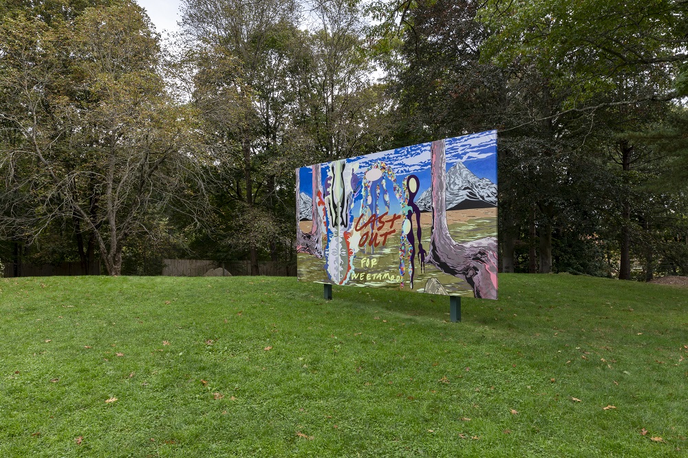 a vibrant artwork on a large billboard in a green park