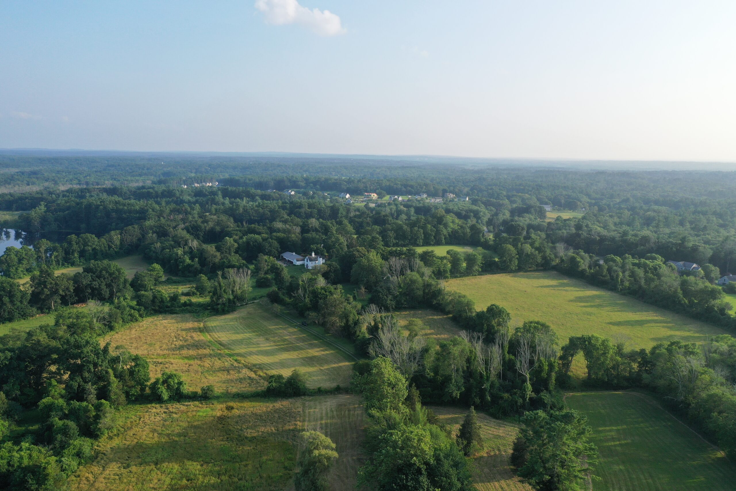 an aerial view of Millborn Farm with fields and a house below