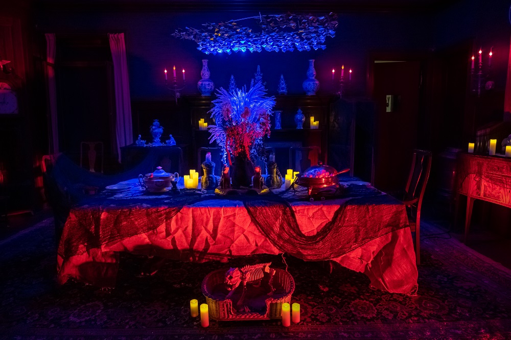 a dark and spooky dining room at Naumkeag , decorated for Halloween