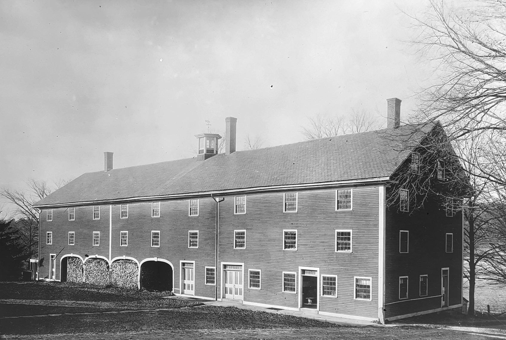 A black and white photo of Herb House at Harvard Shaker village