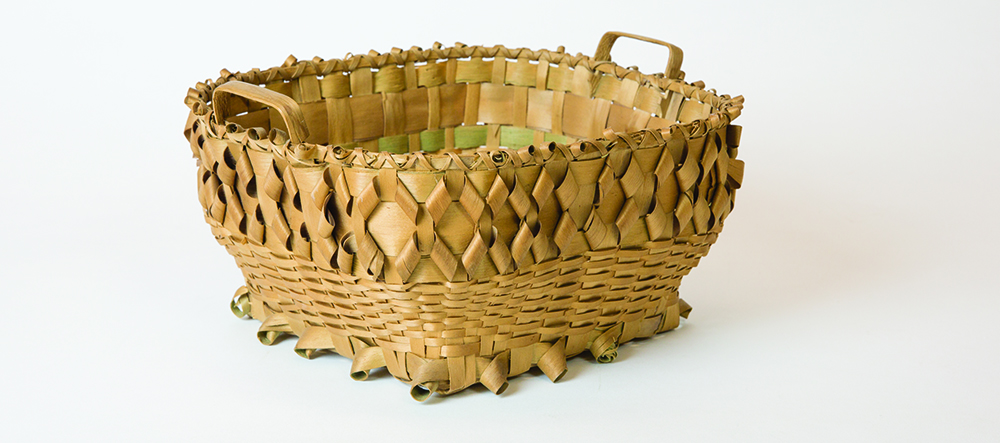 a woven basket from a Mi'kmaq artist once known