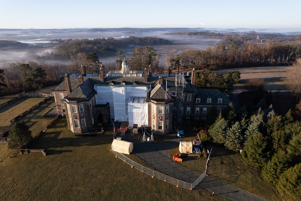 an foggy aerial view of castle hill on the crane estate with construction scaffolding
