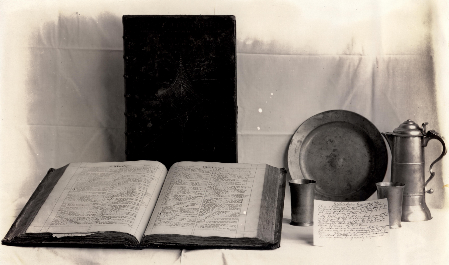 The two-volume Bible and four-piece pewter Communion set. Photograph courtesy of the Arvid E. Miller Library-Museum.