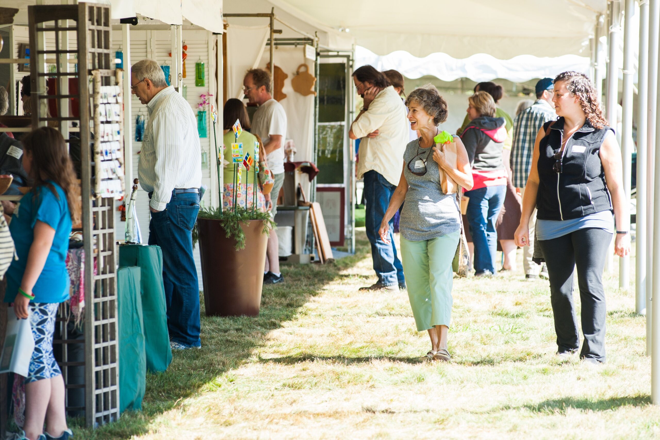 Shoppers look at artisan booths during the Fruitlands Craft Festival.