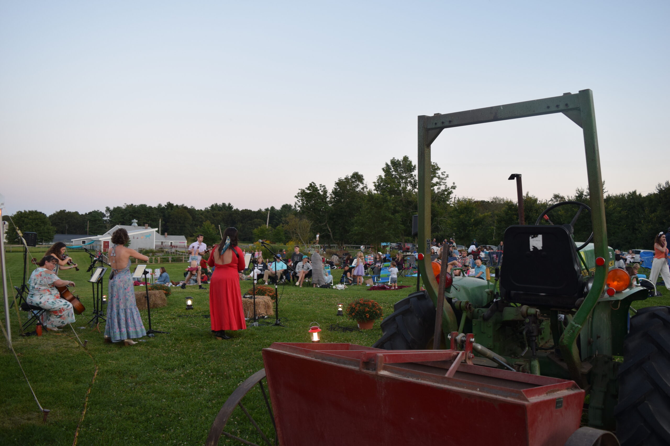 Performers and an audience at Powisset Farm