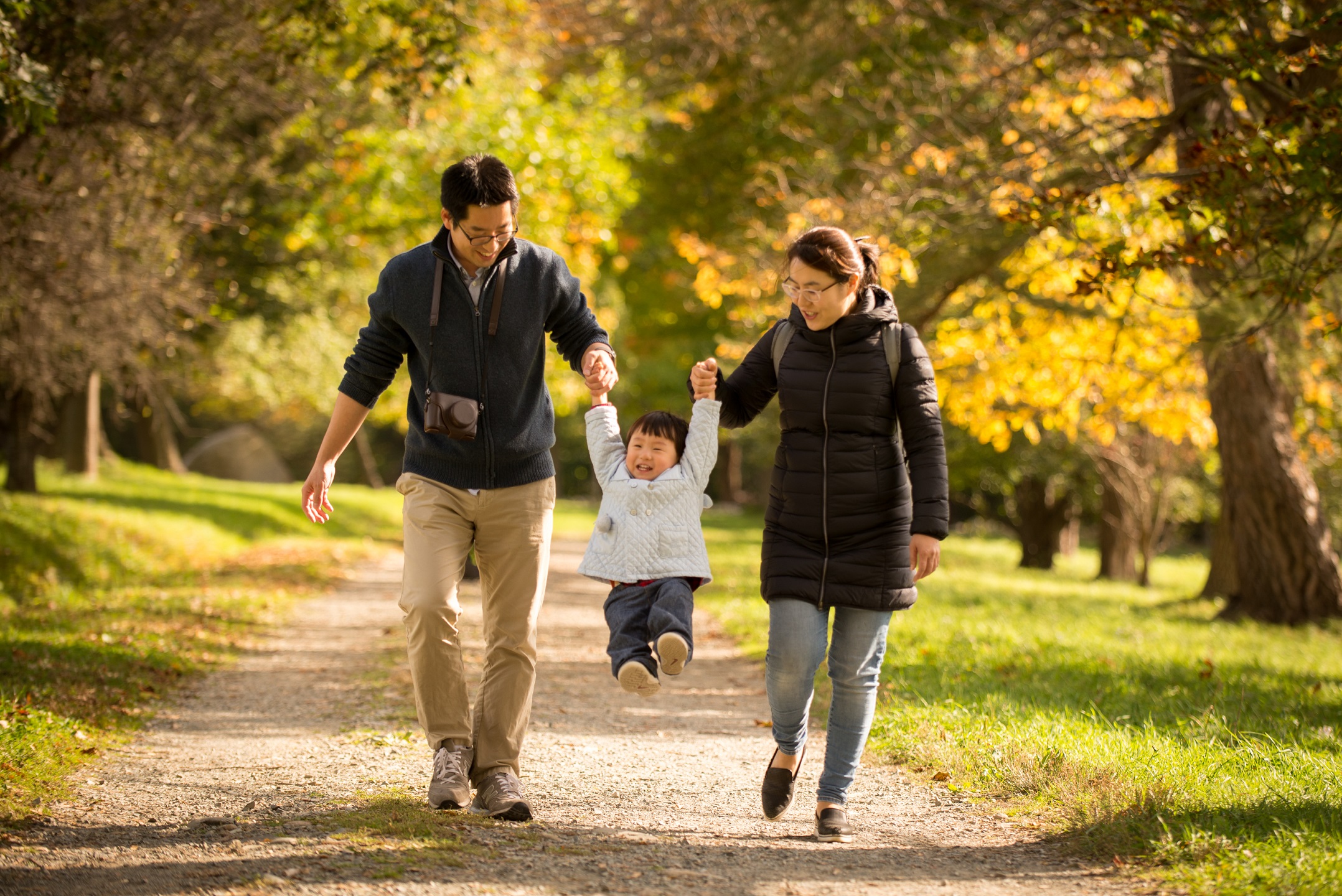 A family hikes with their child at World's End during the fall.