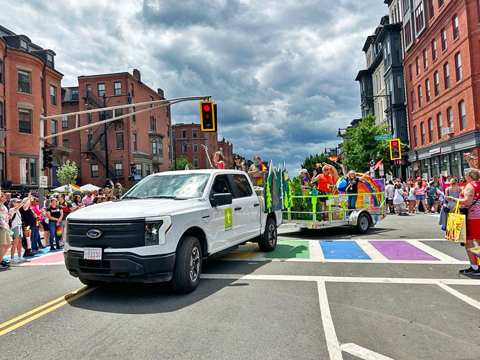 The Trustees Pride Float in 2024 rounds a corner on the parade route