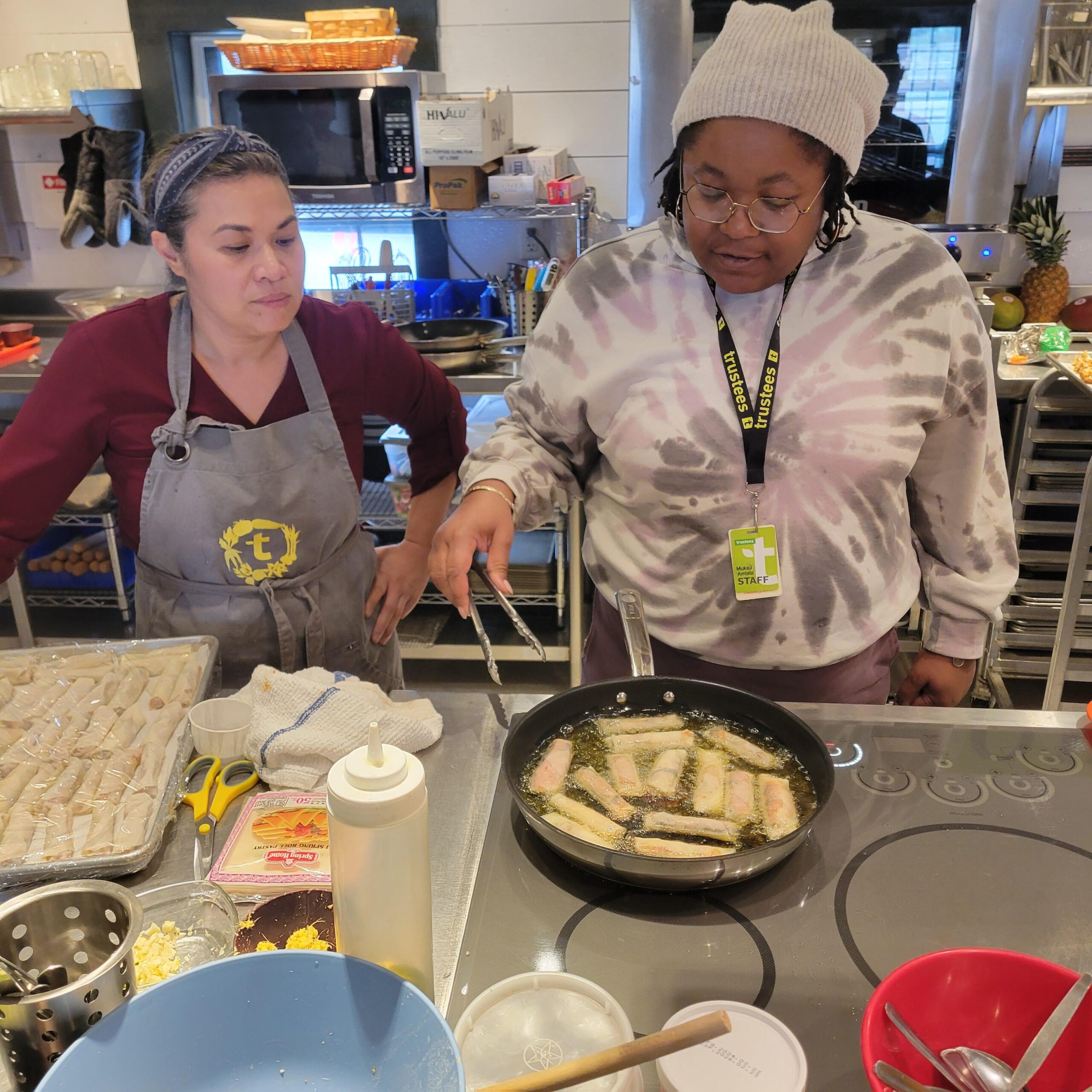 Two people cooking