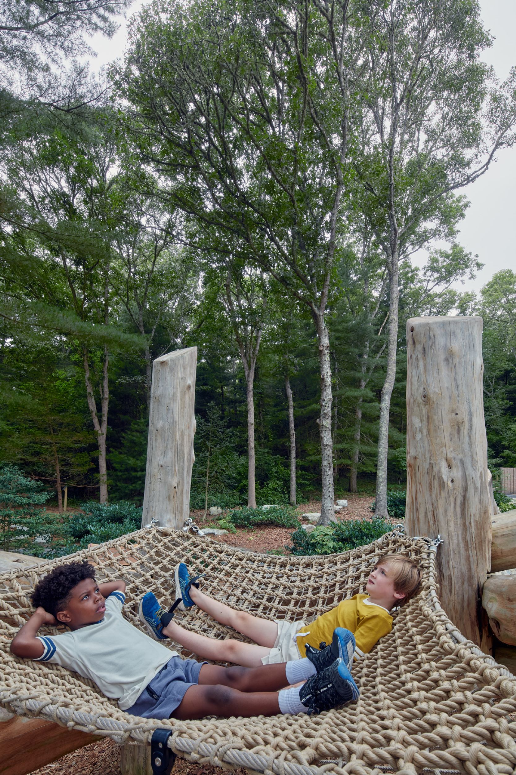 Two kids sit in a hammock net at Armstrong-Kelly Park's Play Space. Photo by Jane Messinger. Courtesy of Lu — La Studio.