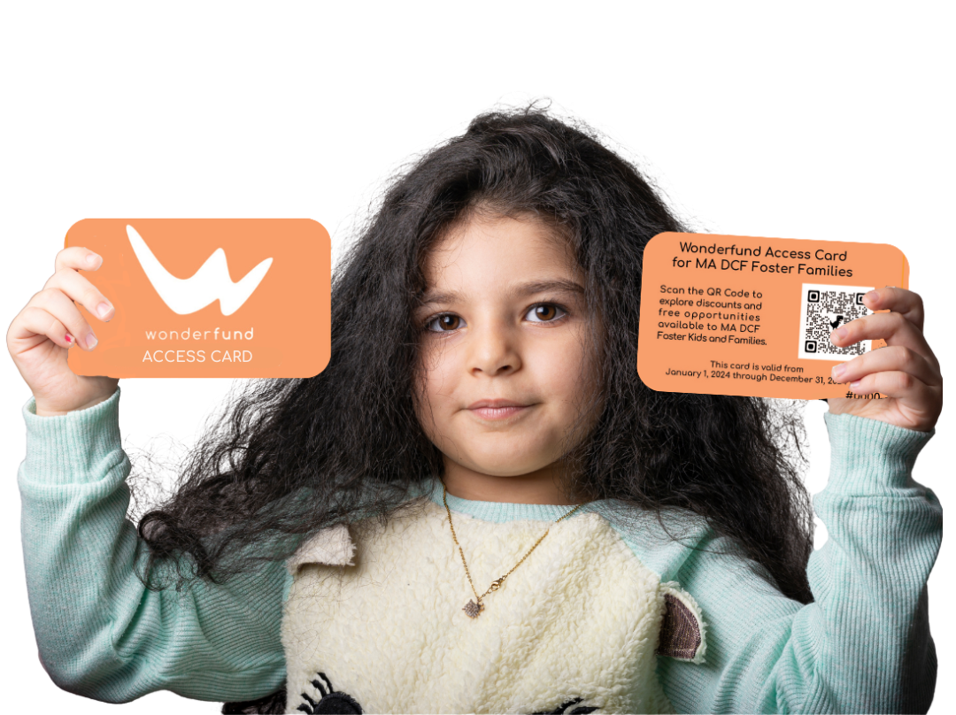 A child holds up two Wonderfund Access Cards. Photo courtesy of Wonderfund.