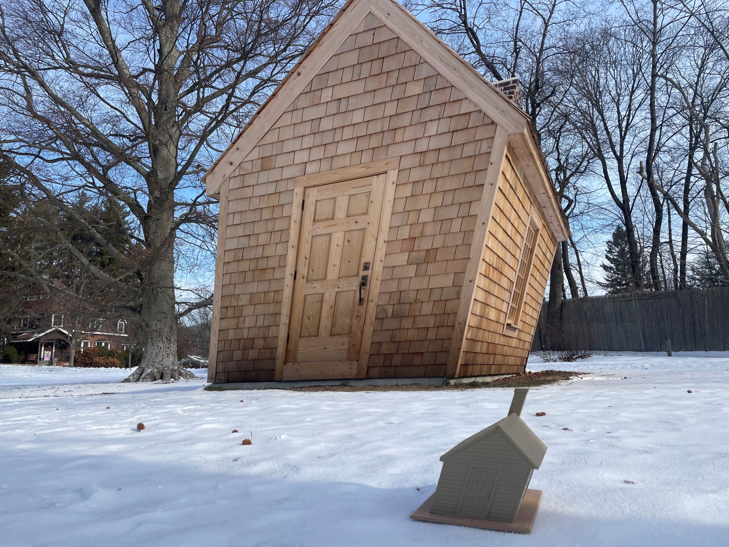 A tactile model of Huff and a Puff by Hugh Hayden next to the sculpture at deCordova