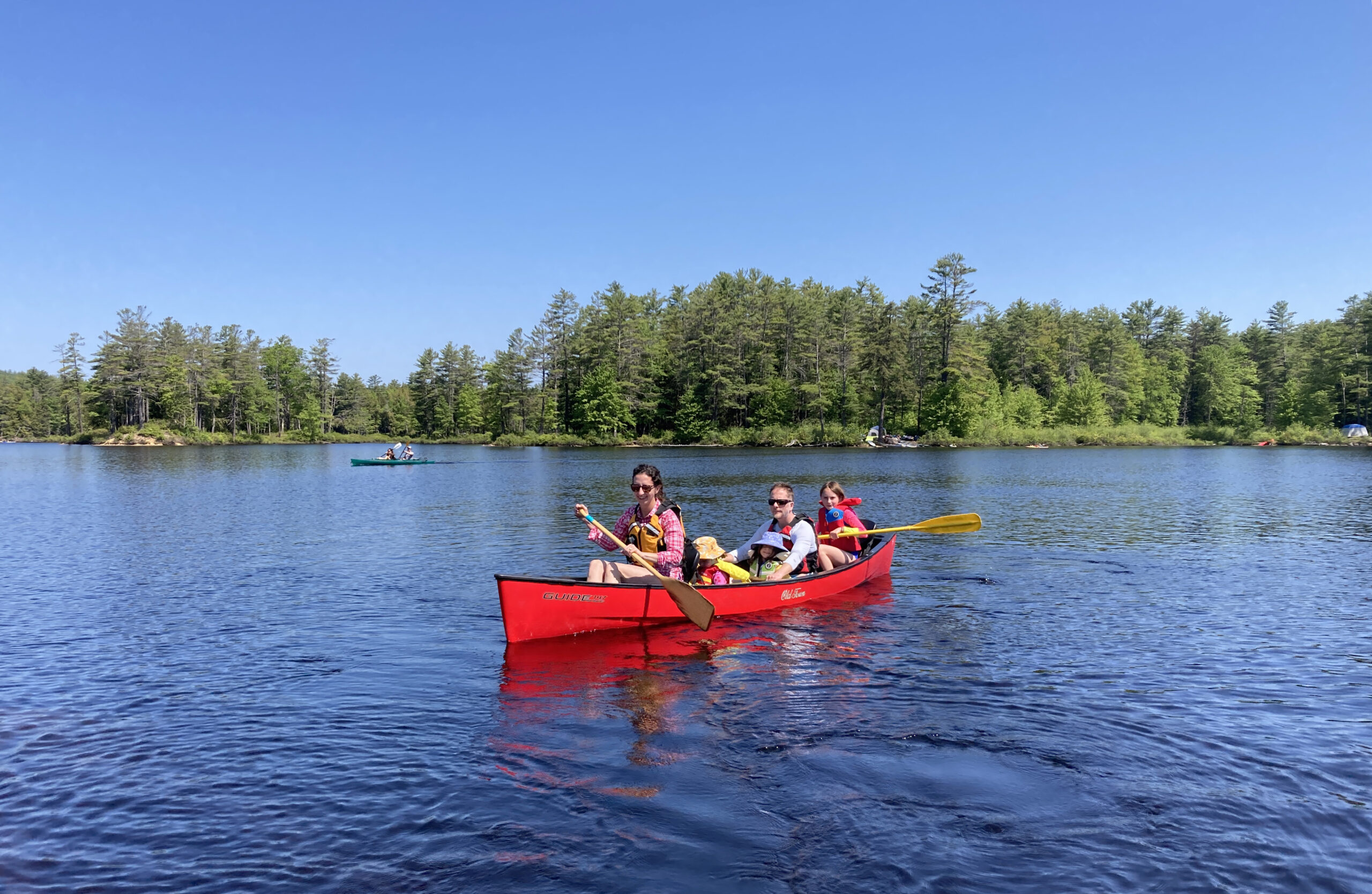 A family paddles along Tully Lake (Royalston) in a rented canoe.