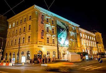 A large building illuminated by light at night